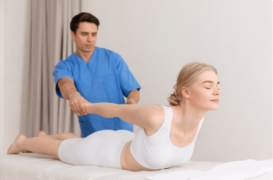 Myoskeletal Therapist working with client in cobra stretch session